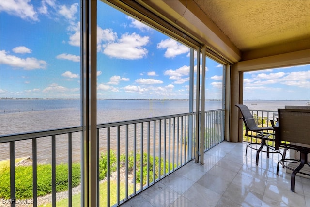 15220 Portside Dr Unit 301, Fort Myers, FL 33908 - sunroom with a water view