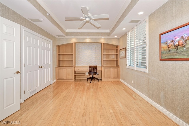 15220 Portside Dr Unit 301, Fort Myers, FL 33908 - unfurnished office with a tray ceiling, wallpapered walls, built in study area, crown molding, and hardwood / wood-style floors