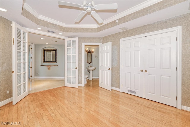 15220 Portside Dr Unit 301, Fort Myers, FL 33908 - unfurnished bedroom featuring a raised ceiling, visible vents, light wood finished floors, and ornamental molding