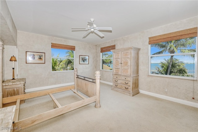 15220 Portside Dr Unit 301, Fort Myers, FL 33908 - unfurnished bedroom featuring ceiling fan, light carpet, and baseboards