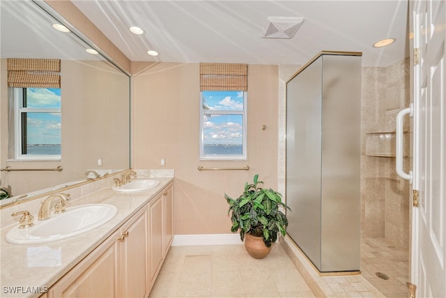 15220 Portside Dr Unit 301, Fort Myers, FL 33908 - full bathroom featuring baseboards, a sink, double vanity, and a tile shower