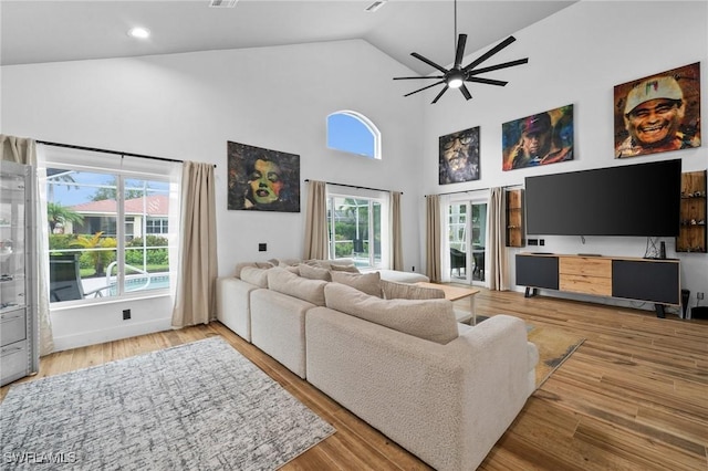 2513 Blackburn Cir, Cape Coral, FL 33991 - living room featuring high vaulted ceiling, ceiling fan, healthy amount of natural light, wood finished floors, and recessed lighting
