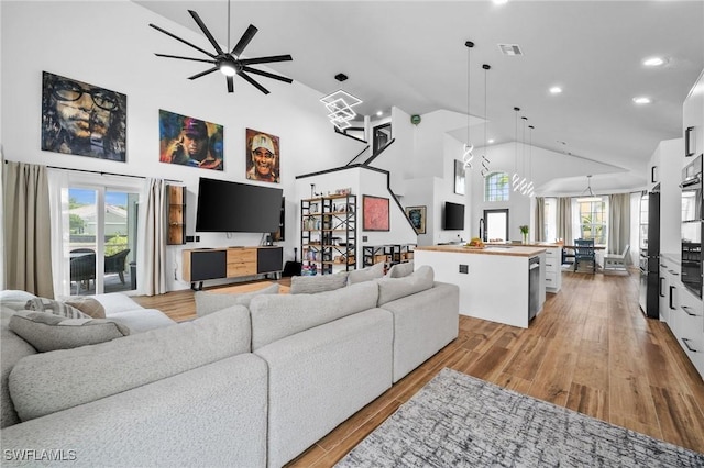2513 Blackburn Cir, Cape Coral, FL 33991 - living room with high vaulted ceiling, light wood-style floors, ceiling fan, and recessed lighting
