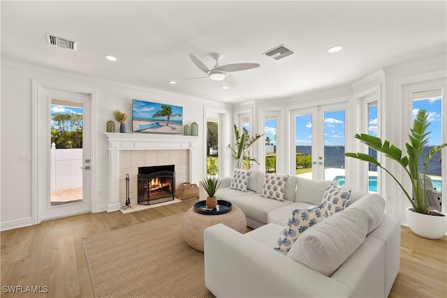 8451 Casa Del Rio Ln, Fort Myers, FL 33919 - living area featuring ornamental molding, visible vents, ceiling fan, and light wood-type flooring