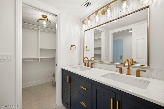 8451 Casa Del Rio Ln, Fort Myers, FL 33919 - full bathroom featuring a sink, visible vents, a spacious closet, and double vanity