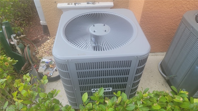 exterior view of cooling unit and stucco siding