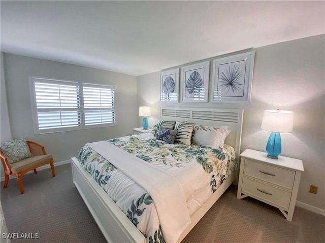 bedroom with baseboards and carpet flooring