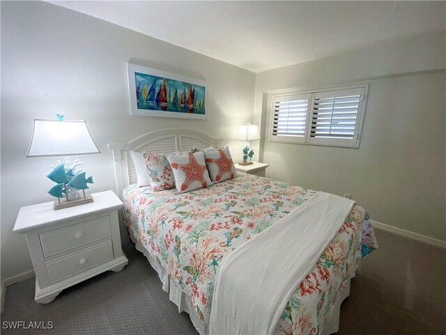 bedroom with carpet floors and baseboards