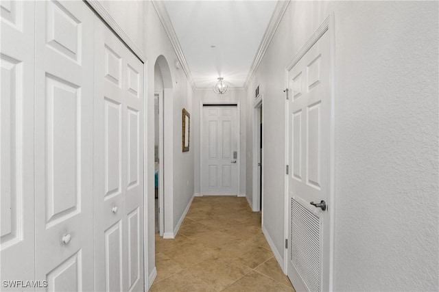 9719 Acqua Ct Unit 241, Naples, FL 34113 - hall with arched walkways, crown molding, light tile patterned floors, and baseboards