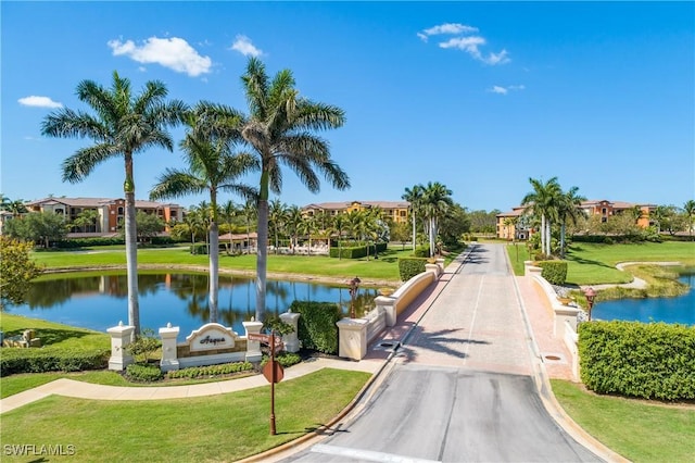 9719 Acqua Ct Unit 241, Naples, FL 34113 - view of property's community featuring a water view and a lawn
