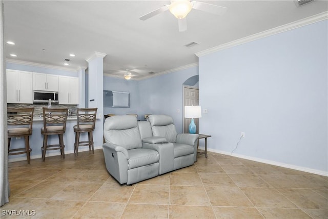 9719 Acqua Ct Unit 241, Naples, FL 34113 - living area with a ceiling fan, crown molding, light tile patterned floors, recessed lighting, and arched walkways