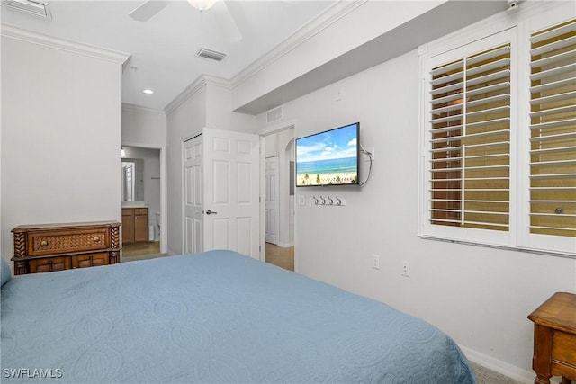 9719 Acqua Ct Unit 241, Naples, FL 34113 - bedroom featuring crown molding, baseboards, ensuite bath, carpet flooring, and ceiling fan