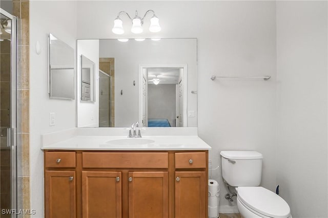 9719 Acqua Ct Unit 241, Naples, FL 34113 - bathroom featuring a stall shower, vanity, toilet, and ensuite bathroom