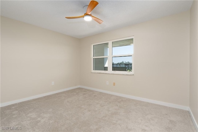 6102 Augusta Dr Unit 315, Fort Myers, FL 33907 - empty room featuring baseboards, a ceiling fan, and carpet flooring