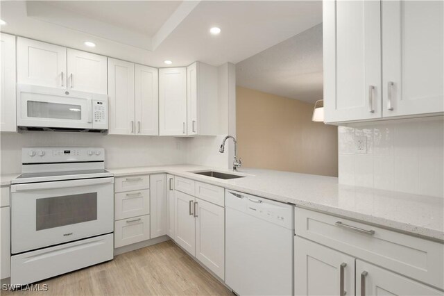 6102 Augusta Dr Unit 315, Fort Myers, FL 33907 - kitchen with recessed lighting, a sink, white cabinetry, and white appliances