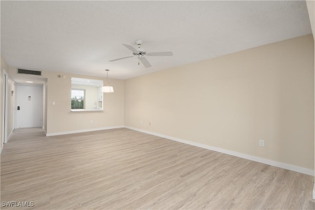 6102 Augusta Dr Unit 315, Fort Myers, FL 33907 - unfurnished room with visible vents, ceiling fan, baseboards, and light wood-style floors