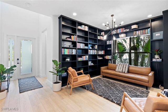 4045 Nova Ln, Naples, FL 34119 - sitting room with recessed lighting, a chandelier, and wood finished floors