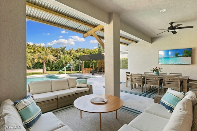 4045 Nova Ln, Naples, FL 34119 - living area with beam ceiling, ceiling fan, and a textured wall