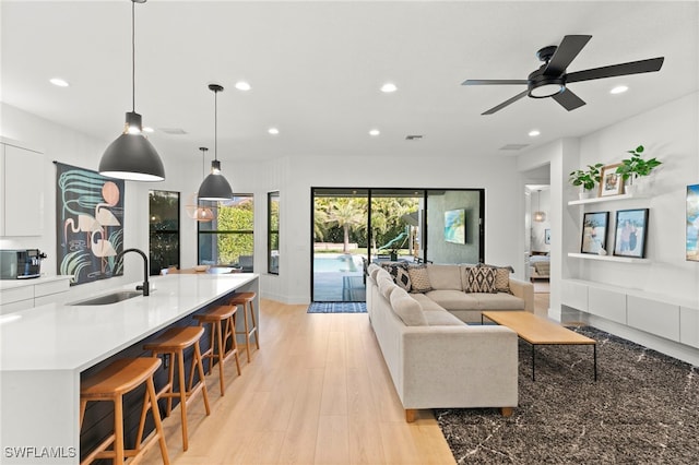 4045 Nova Ln, Naples, FL 34119 - living area featuring light wood-type flooring, baseboards, a ceiling fan, and recessed lighting