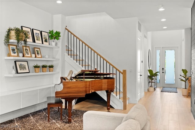 4045 Nova Ln, Naples, FL 34119 - sitting room with recessed lighting, light wood-style flooring, and stairs