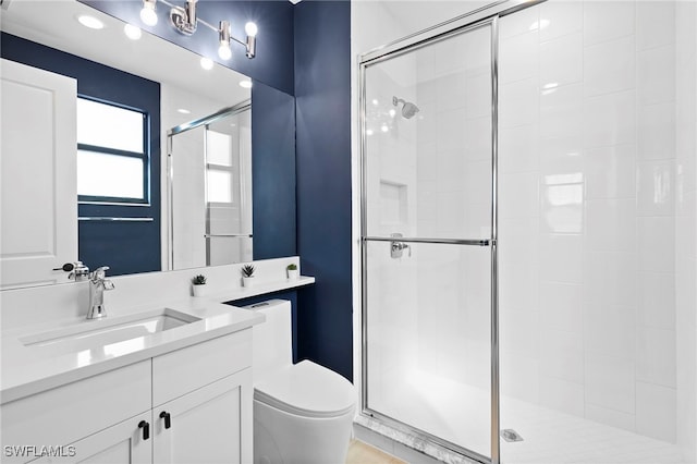 4045 Nova Ln, Naples, FL 34119 - full bathroom with a shower stall, vanity, and toilet