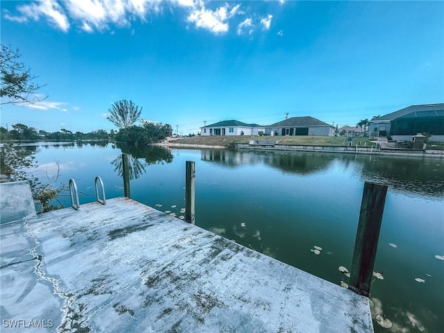 dock area featuring a residential view and a water view