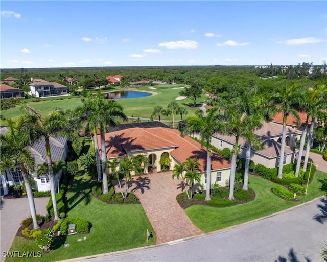 aerial view with view of golf course, a water view, and a residential view