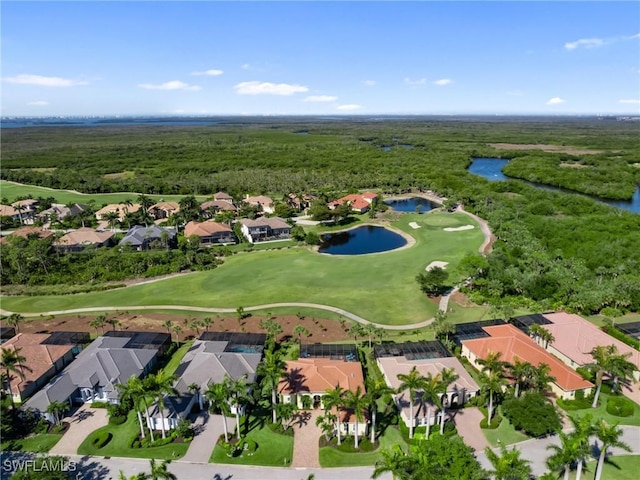 aerial view with a residential view, a water view, and view of golf course