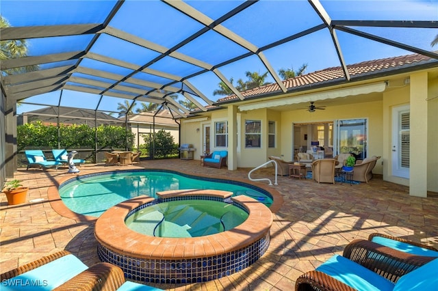 view of pool featuring a grill, an outdoor hangout area, ceiling fan, a patio area, and a pool with connected hot tub