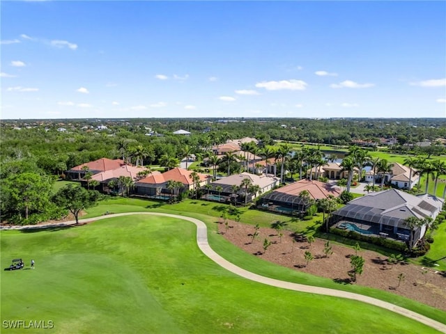 bird's eye view with view of golf course and a residential view