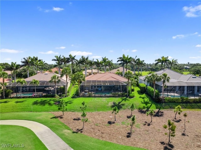surrounding community with a pool and a lawn