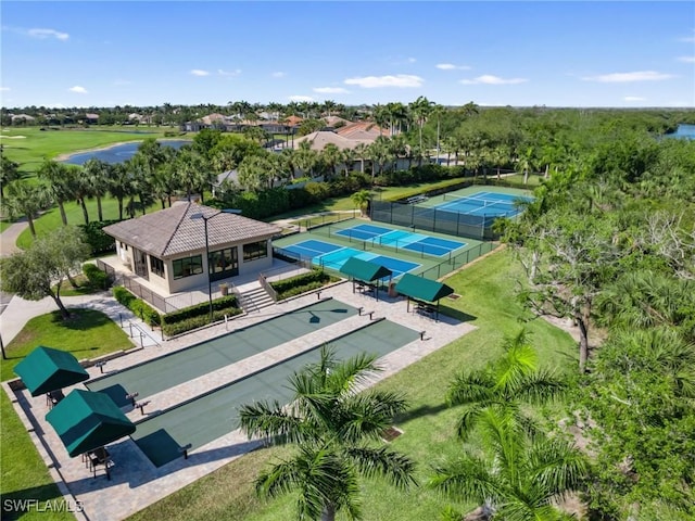 birds eye view of property with a water view