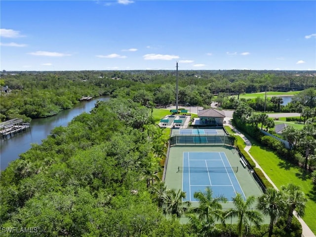 aerial view with a forest view and a water view