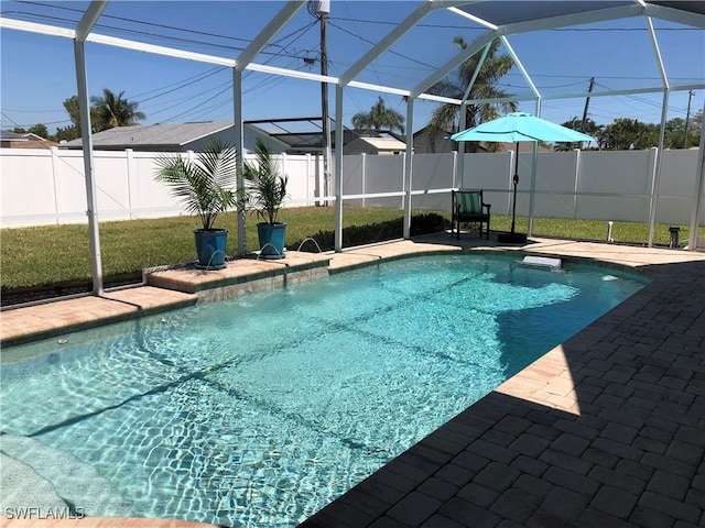 411 SW 34th Ter, Cape Coral, FL 33914 - view of swimming pool with a fenced backyard, a patio, and a lanai
