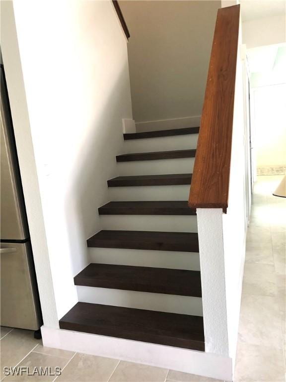 411 SW 34th Ter, Cape Coral, FL 33914 - stairs featuring tile patterned floors