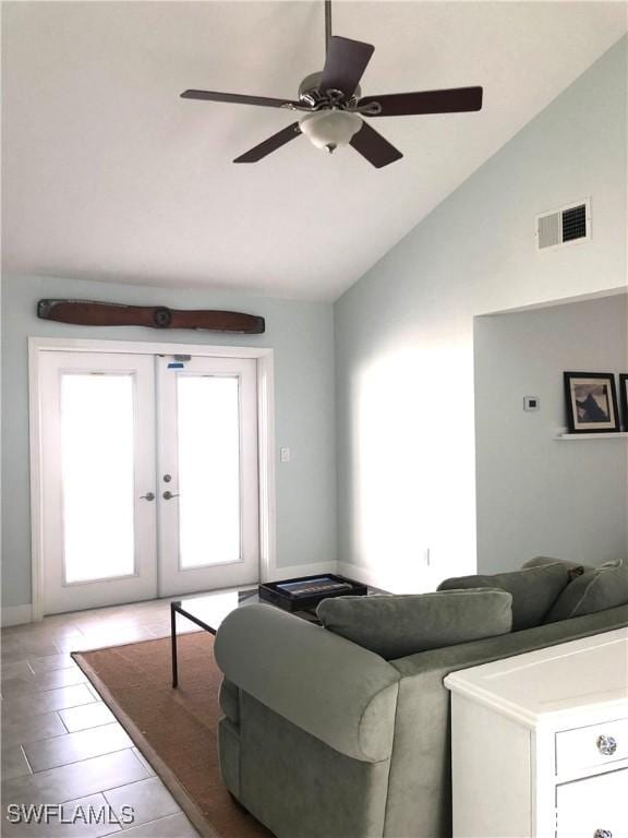 411 SW 34th Ter, Cape Coral, FL 33914 - living room featuring french doors, baseboards, high vaulted ceiling, and a ceiling fan