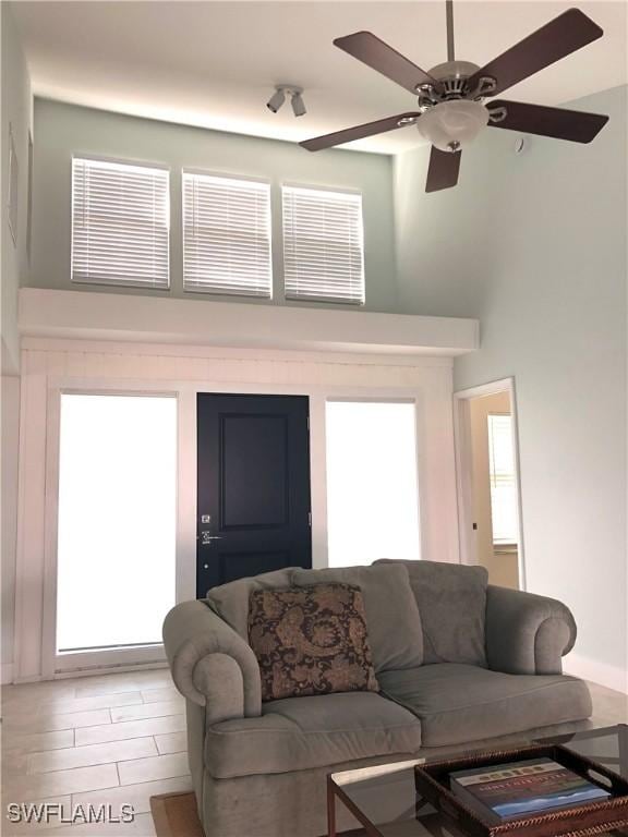 411 SW 34th Ter, Cape Coral, FL 33914 - living room featuring a high ceiling and a ceiling fan