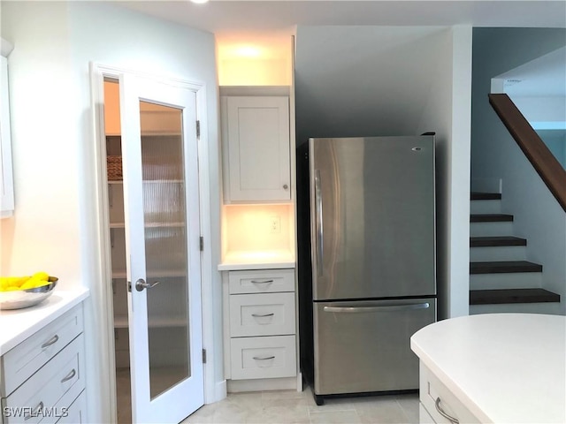 411 SW 34th Ter, Cape Coral, FL 33914 - kitchen with freestanding refrigerator and light countertops