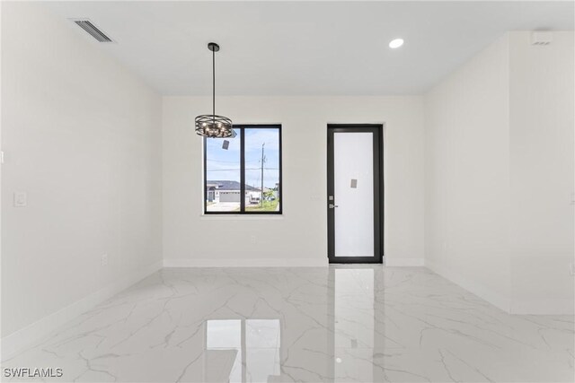 5327 Beauty St, Lehigh Acres, FL 33971 - empty room with visible vents, marble finish floor, baseboards, and a notable chandelier