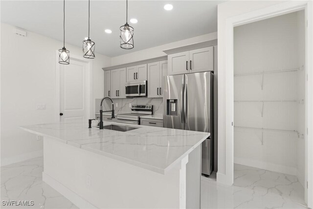 5327 Beauty St, Lehigh Acres, FL 33971 - kitchen with stainless steel appliances, a sink, baseboards, recessed lighting, and marble finish floor