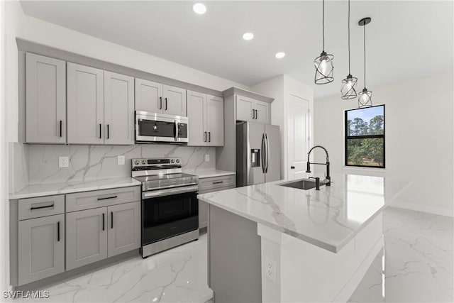 5327 Beauty St, Lehigh Acres, FL 33971 - kitchen with marble finish floor, stainless steel appliances, backsplash, a sink, and gray cabinetry