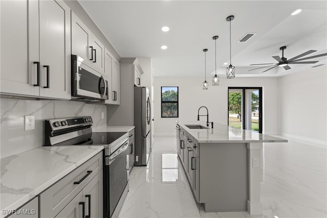 5327 Beauty St, Lehigh Acres, FL 33971 - kitchen featuring a sink, marble finish floor, appliances with stainless steel finishes, visible vents, and recessed lighting