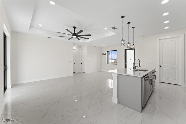 5327 Beauty St, Lehigh Acres, FL 33971 - kitchen featuring a tray ceiling, a sink, visible vents, recessed lighting, and marble finish floor