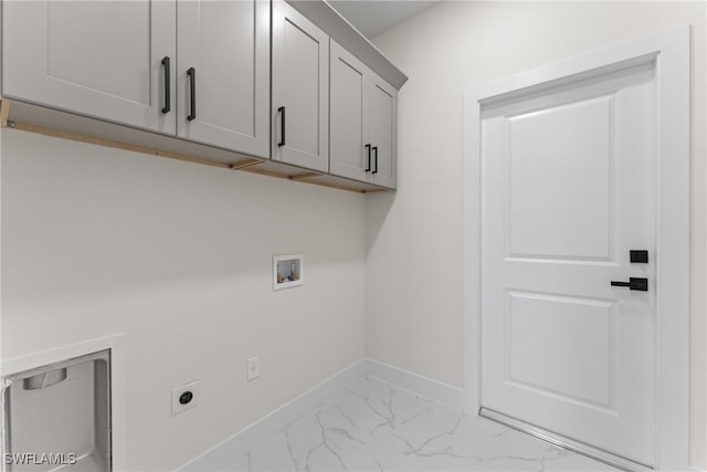 5327 Beauty St, Lehigh Acres, FL 33971 - washroom featuring electric dryer hookup, marble finish floor, cabinet space, baseboards, and washer hookup