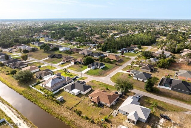 5327 Beauty St, Lehigh Acres, FL 33971 - drone / aerial view with a residential view and a water view