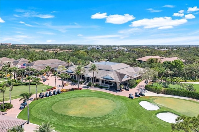 bird's eye view with view of golf course and a residential view
