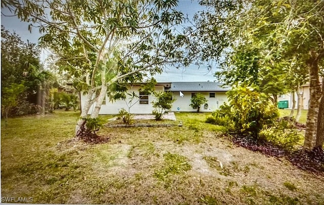 21070 Delake Ave, Port Charlotte, FL 33954 - rear view of property featuring a yard