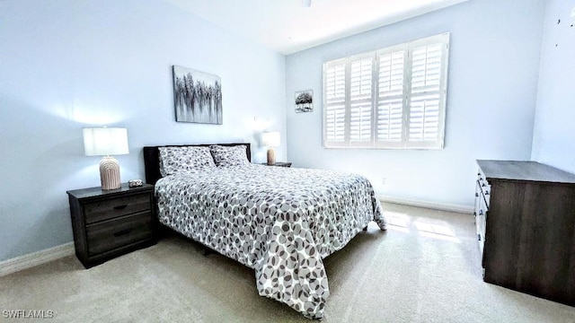 bedroom featuring carpet flooring and baseboards