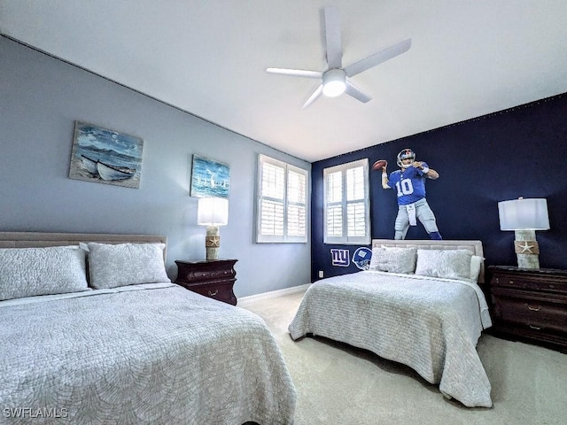 bedroom with baseboards, a ceiling fan, and carpet