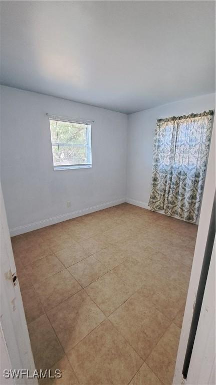 509 W Obispo Ave, Clewiston, FL 33440 - unfurnished room featuring baseboards